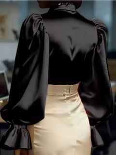 Black satin blouse with pointed collar and gathered flounce cuffs at wrists
