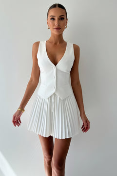 White button-up vest and pleated mini skirt set
