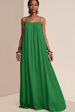 Green spaghetti strap flowy maxi dress with ruched neckline and long flowing skirt