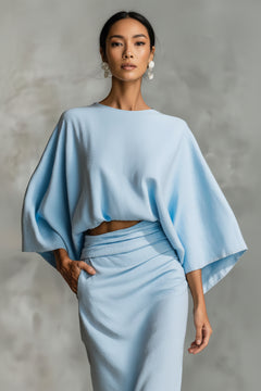 Light blue kimono-sleeve crop top with wide sleeves and ruched midi skirt