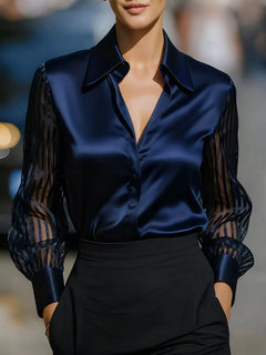 Navy blue collared blouse with button-front V-neck and sheer striped sleeves