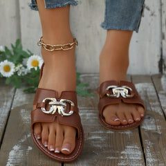 Brown open-toe sandals with chain-link ankle strap and gold-tone buckle decor.