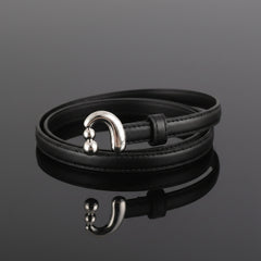 Black skinny leather belt with silver buckle and round keeper hardware
