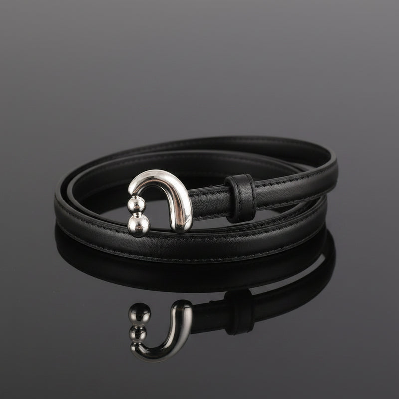 Black skinny leather belt with silver buckle and round keeper hardware