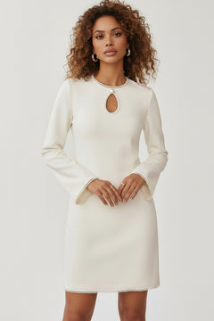White mini dress with keyhole neckline and pearl trim, long sleeves
