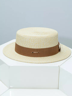 Beige straw boater hat with brown ribbon band and gold bar detail