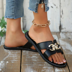 Black flat open toe sandals with front buckle detail and gold-toned chain accent