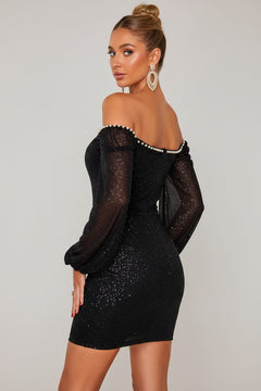 Black sequin mini dress, pearl-trimmed sweetheart neckline with long sheer puff sleeves