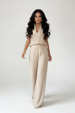 Beige sleeveless V-neck top with matching wide-leg pants, waist seam