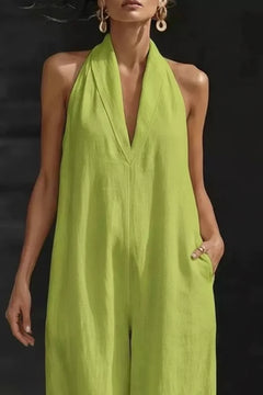 Lime green sleeveless wide-leg halter jumpsuit with deep V neckline and draped front