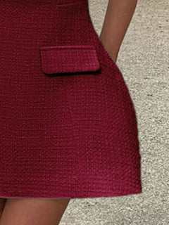 Wine red mini dress front with flap pocket and textured fabric