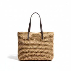 Woven straw tote bag, dark tan woven straw with brown leather handles, open top.