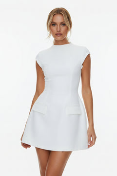 Mock neck A-line mini dress in white with short sleeves and two front patch pockets