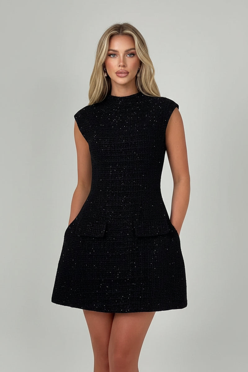 Black textured mini dress, round neck, cap sleeves, flared skirt with front flap pockets