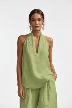 Light green halter neck top and wide-leg pants set with deep V neckline