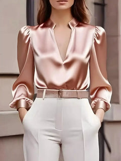 Pink notched long-sleeve blouse with deep V neckline and gathered puff shoulders