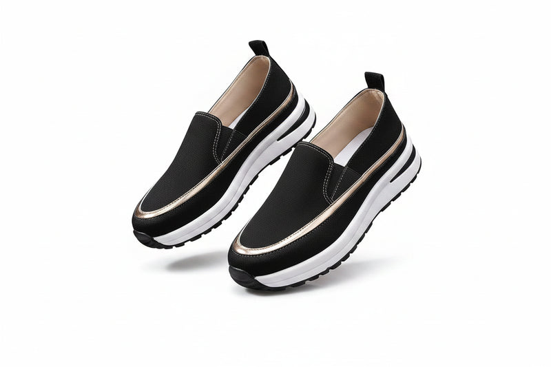 Black platform loafers, slip-on vegan style, low heel, white ridged sole.