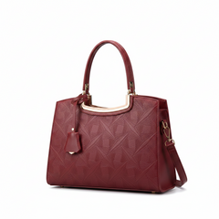 Wine red embossed leather top handle handbag with gold hardware and detachable strap