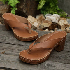 Tan toe-post block-heel sandals with perforated footbed, stitched outsole, and thick heel.