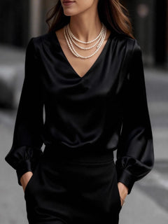 Black satin V-neck puff sleeve blouse with gathered cuffs