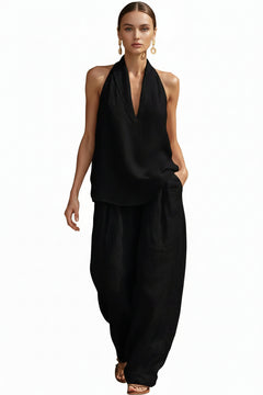 Black halter neck top and wide-leg pants set with deep V neckline