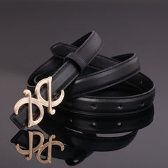 Black leather belt with ornate metallic buckle and punched holes