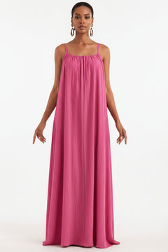 Fuchsia pink spaghetti-strap maxi dress with gathered bodice and long, fluid drape