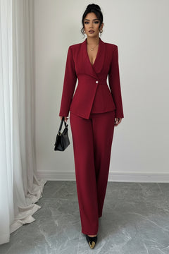 One-button blazer and pants set in burgundy, featuring a tailored peplum waist detail.