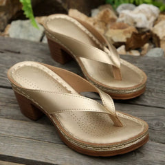 Gold-tone toe-post block-heel sandals with perforated insole and textured midsole trim.