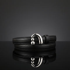 Black skinny leather belt with silver O-ring buckle and decorative bead details