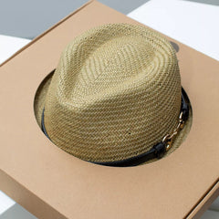 Straw fedora hat with decorative dark band on brim and crown