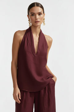 Burgundy halter neck top and wide-leg pants set with V-front and layered hem