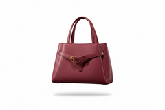 Burgundy leather top-handle handbag, front view with buckle strap closure