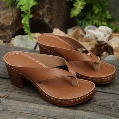 Tan toe-post block-heel sandals with perforated insole and two-piece thong strap.