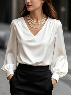 White satin V-neck puff sleeve blouse with gathered cuffs