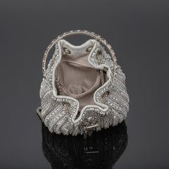 Silver rhinestone bucket crossbody bag open view with fabric lining and chain strap