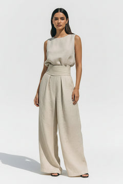 Ivory sleeveless turtleneck top and wide-leg pants set, three-quarter front