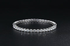Silver bracelet on a dark textured surface 