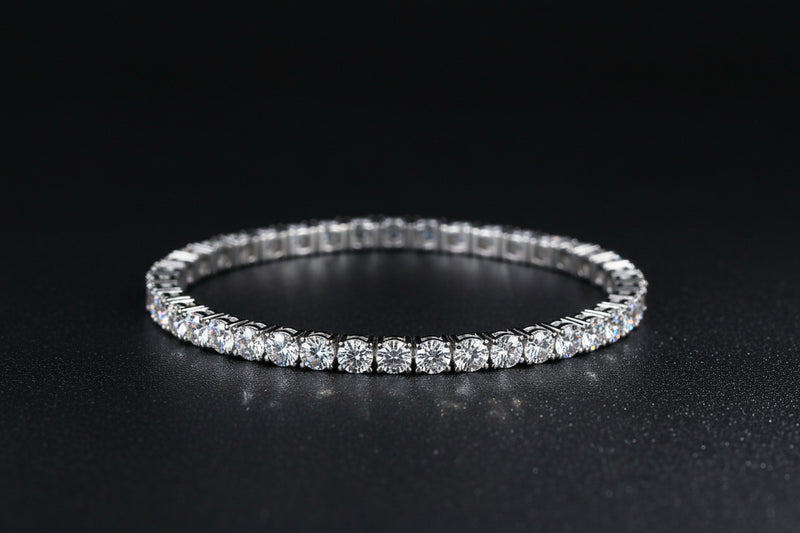 Silver bracelet on a dark textured surface 