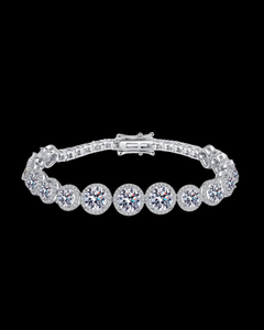Silver bracelet with round diamonds on a black background