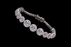 Silver bracelet with gemstones on a black background