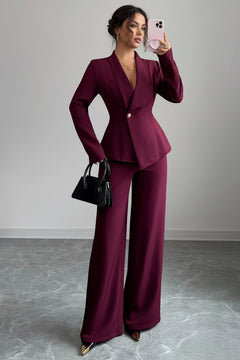 Burgundy one-button blazer and wide-leg pants set, V-neck peplum-style jacket.
