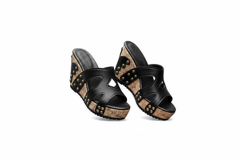 Black open-toe wedge sandals with studded straps and cork-pattern midsole