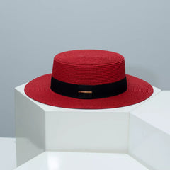 Boater straw hat with band, red straw with black band