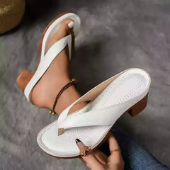 White toe-post block-heel sandals with perforated footbed and T-strap thong.