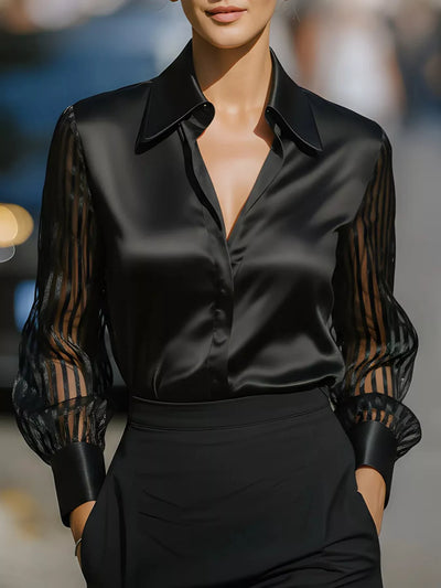 Black collared blouse with button-front V-neck and sheer striped sleeves