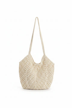 Woven straw hobo bag in rice white, compact rounded basket with open top and woven handles