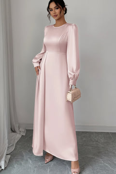 Blush pink satin long sleeve maxi dress with crew neck, gathered waist, flowing skirt