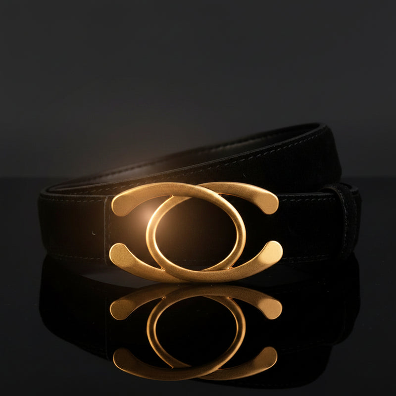 Black leather statement buckle belt with gold-tone circular ring centerpiece