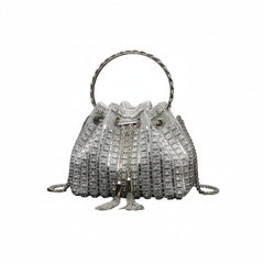 Silver rhinestone bucket crossbody bag with rounded top handle and braided side cords.